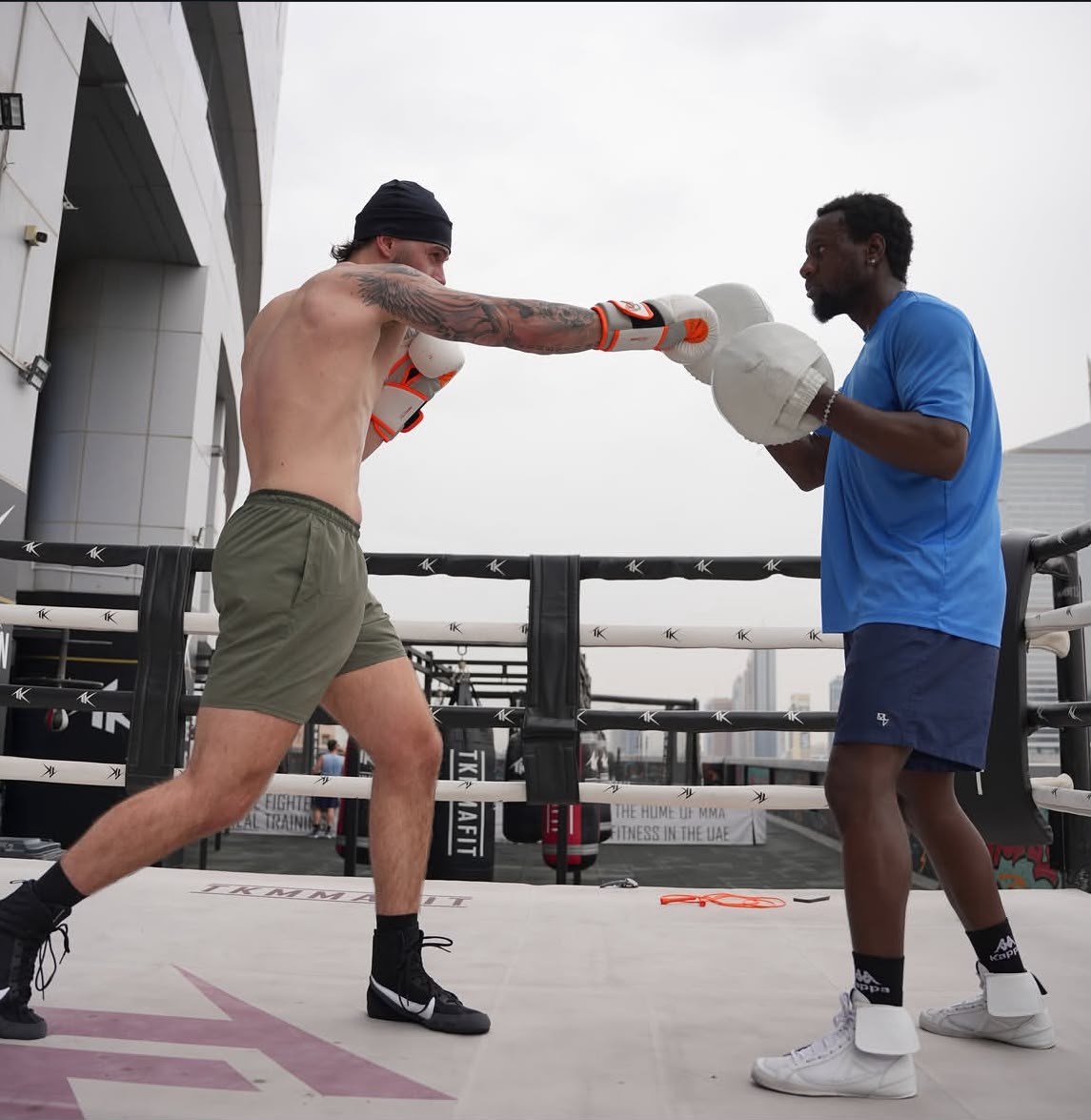 Boxer throwing a jab on the pads